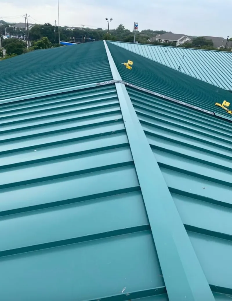 Green commercial metal roof ridge and valley for Metal Roof Repair in Eldorado at Santa Fe